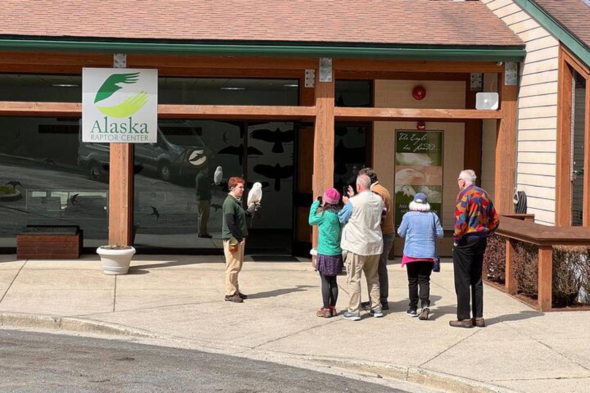 a group of people standing outside of a store