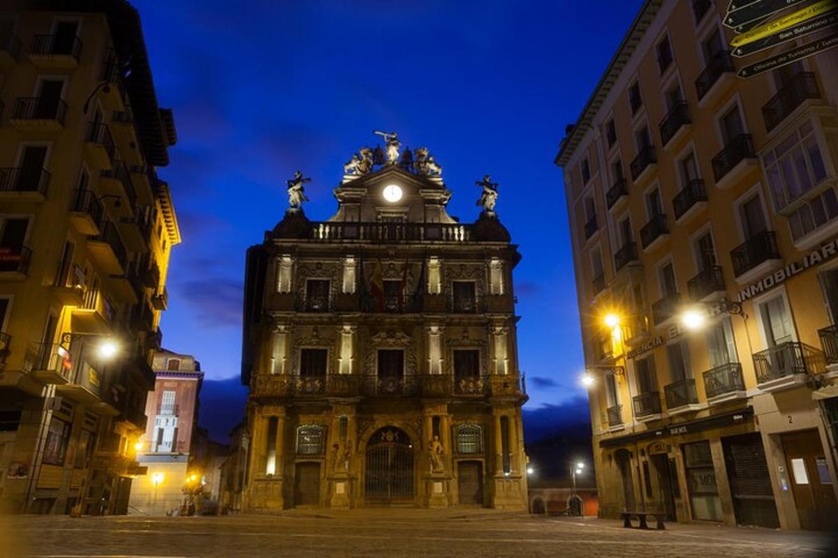a large building with a clock tower at night