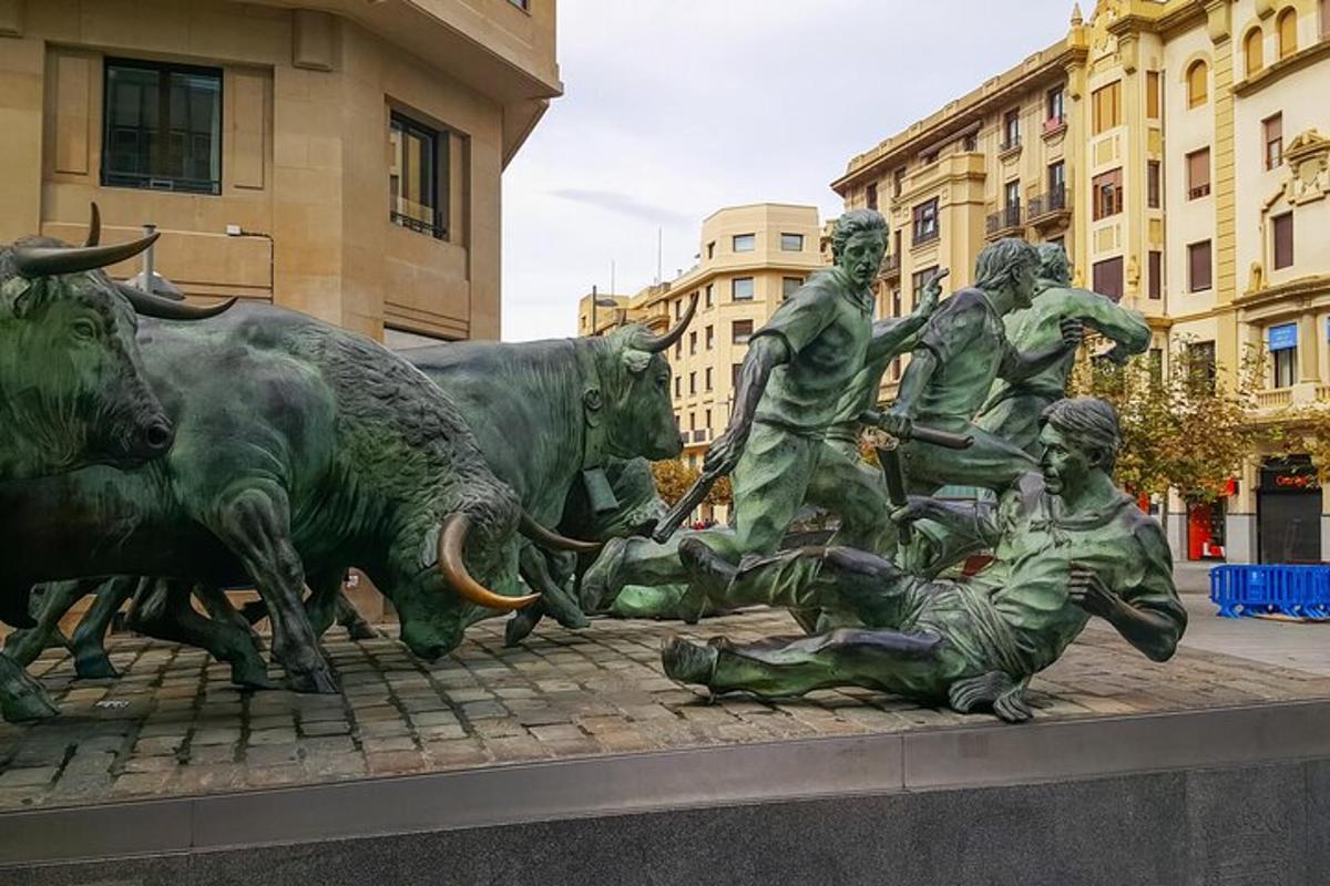a statue of a group of bulls laying on the ground
