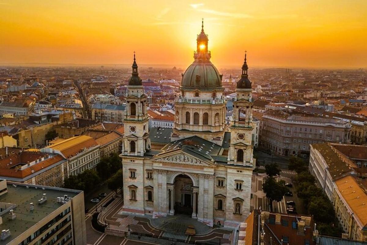 an old building with a sunset in the background