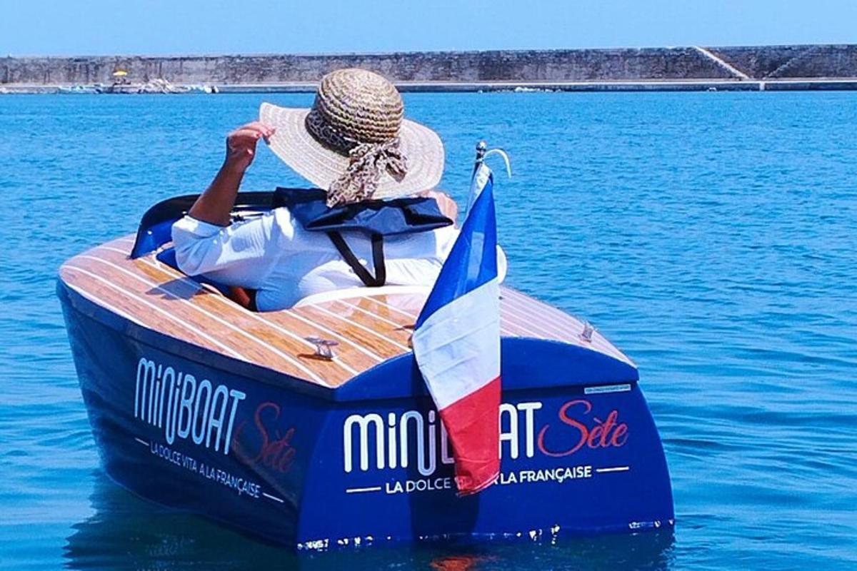 a man is sitting in a boat on the water
