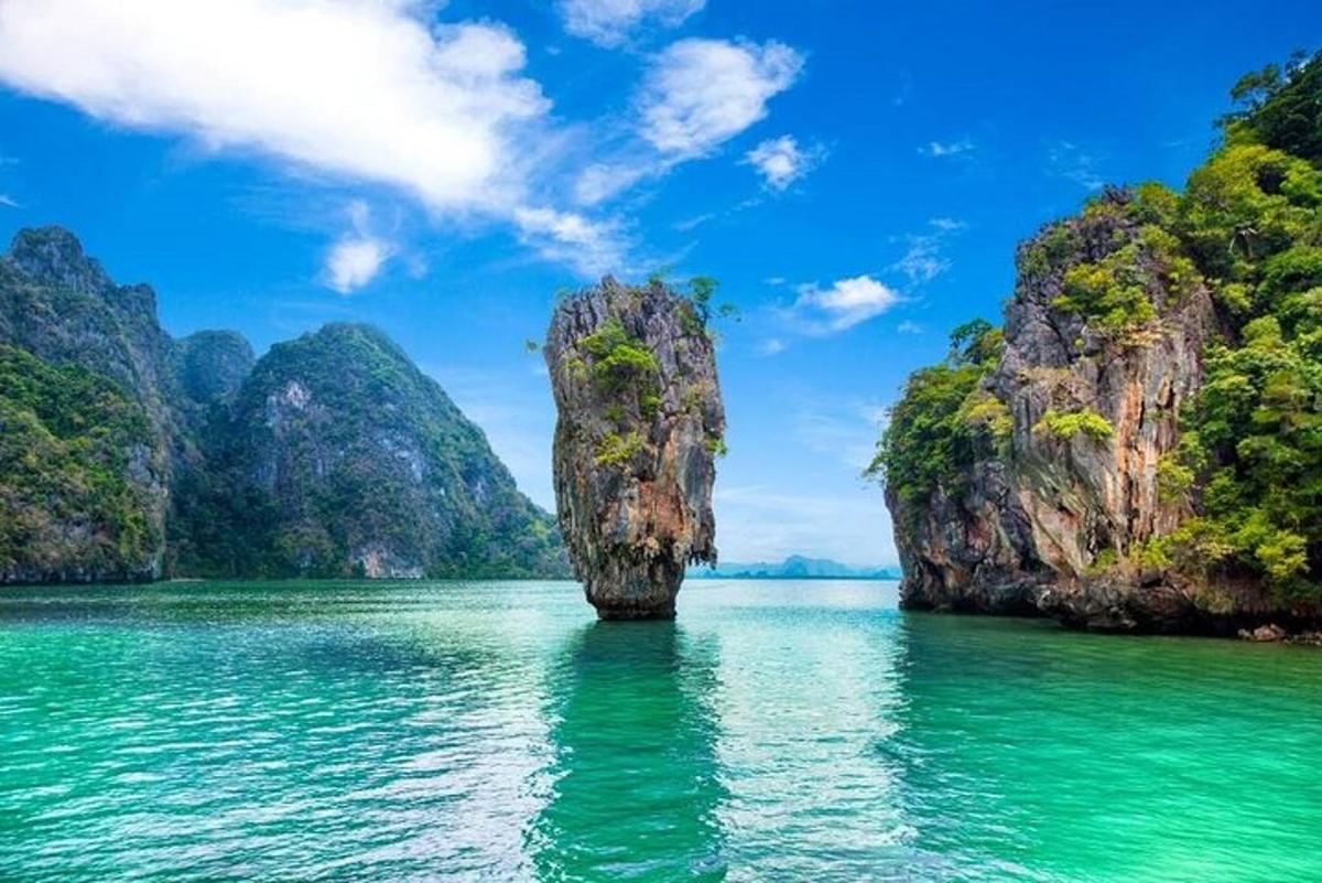 a small island in the water with limestone cliffs