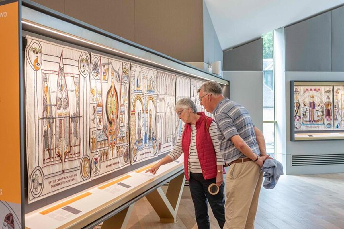 two older men looking at a table in a museum