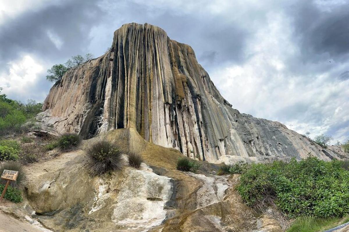 a large rock formation on the side of a mountain