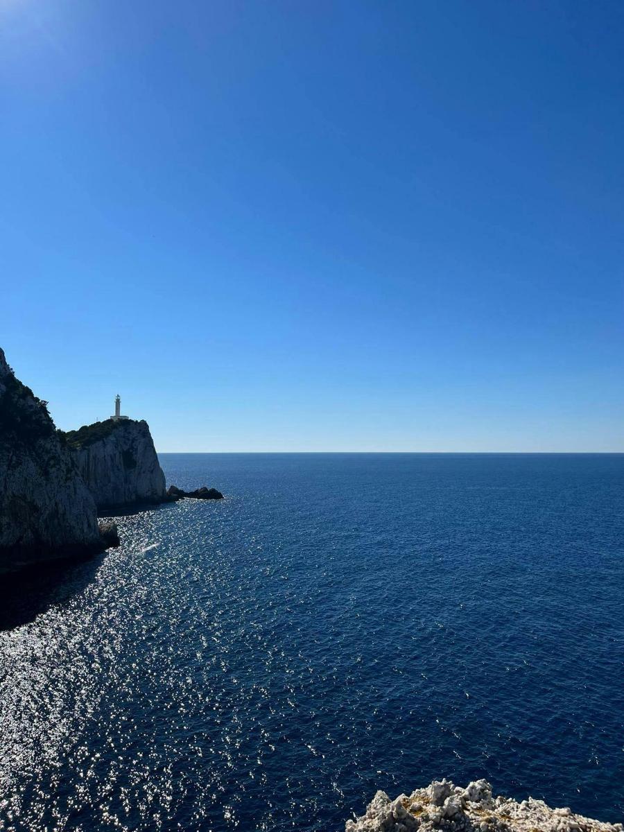 a view of the ocean from a rocky beach