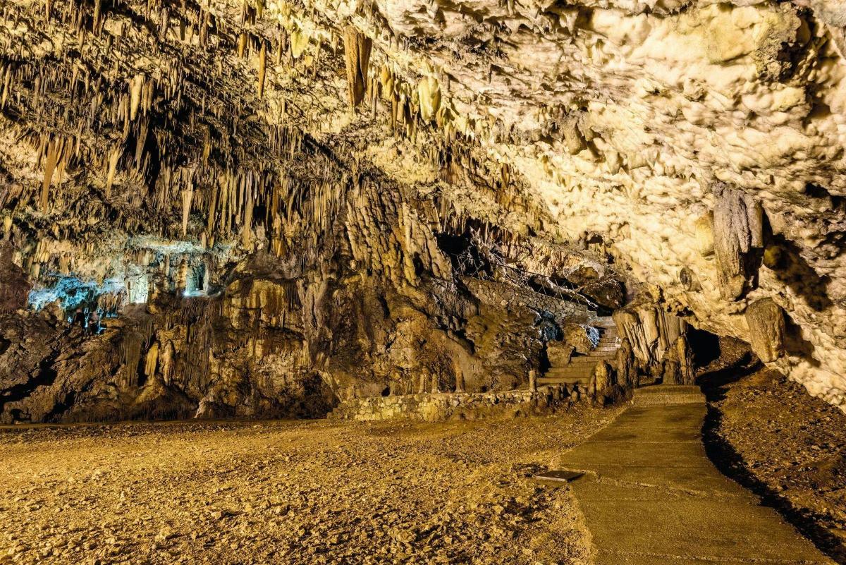 a cave with a path inside of it