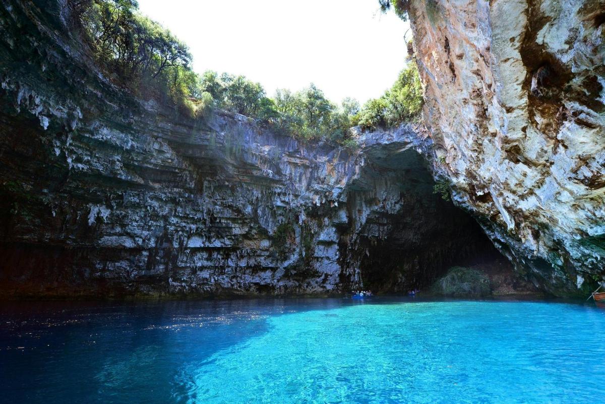 a pool of blue water in a cave