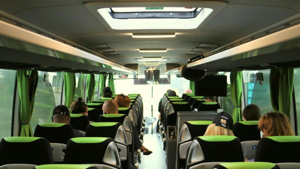 a group of people sitting on a bus
