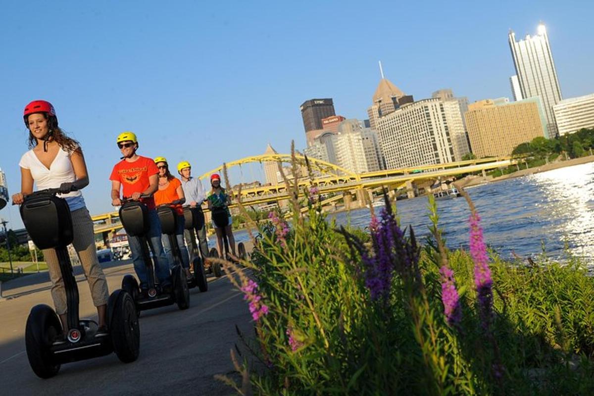 a group of people riding on segifts on a bridge
