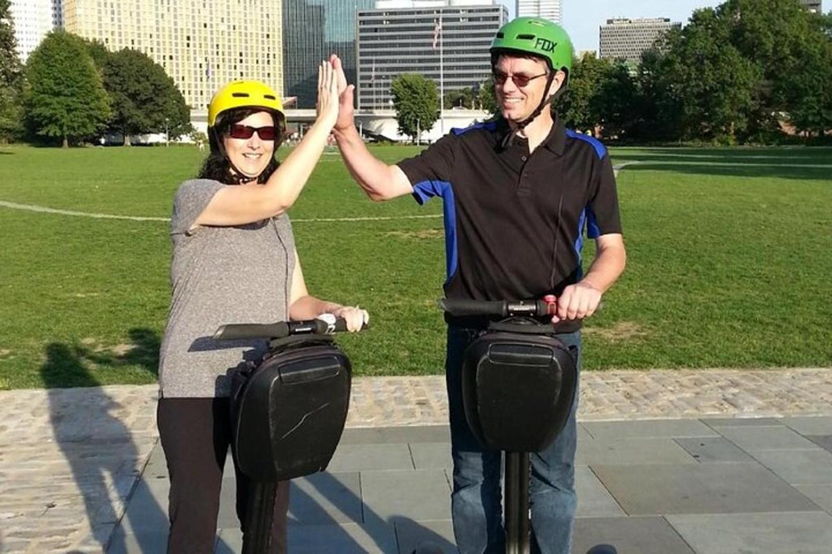 a man and woman are giving each other a high five