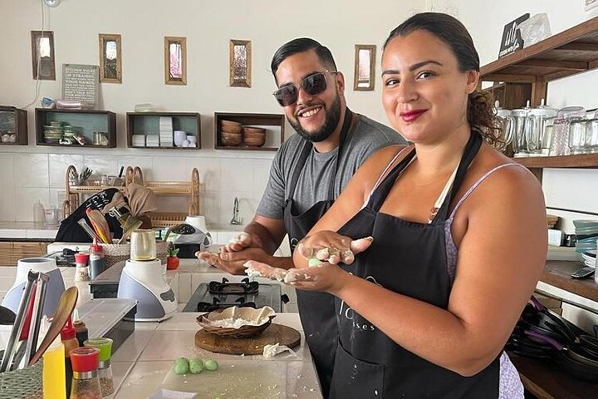 a man and a woman in a kitchen preparing food