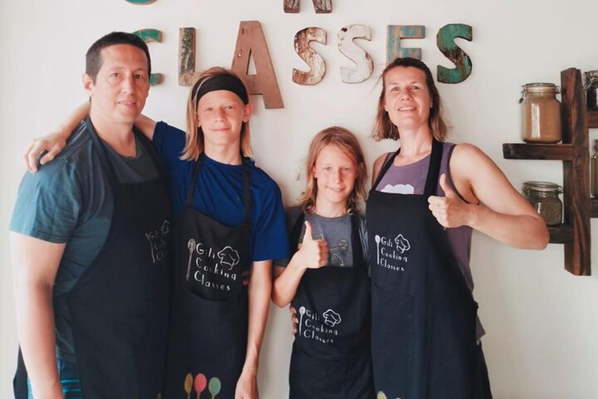 a family posing for a picture in front of a sign