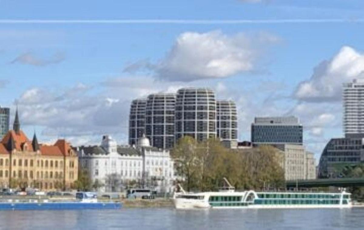 a view of a city with a river and buildings