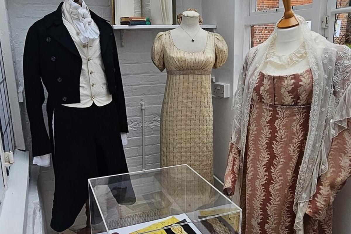 two mannequins in a display case in a museum