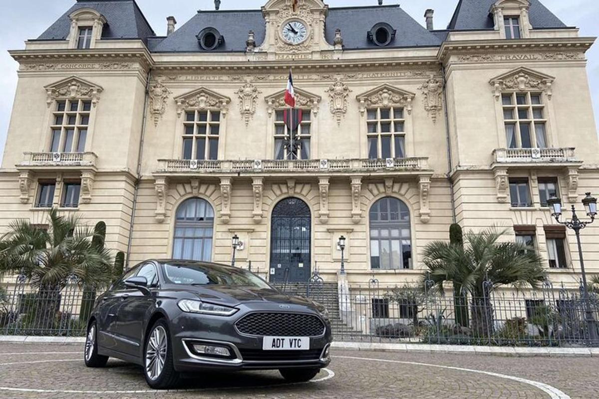 a black car parked in front of a building