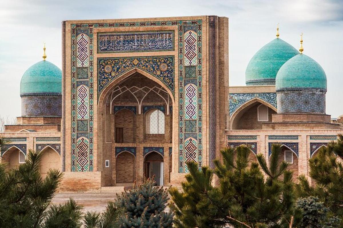 a mosque with two domes on the side of it
