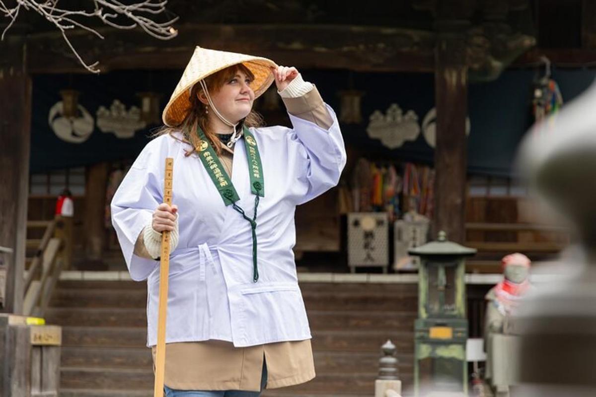 a woman wearing a straw hat and holding a wand
