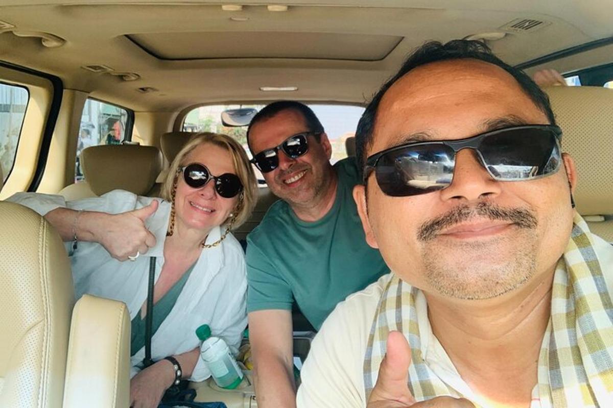 a group of people sitting in the back of a car