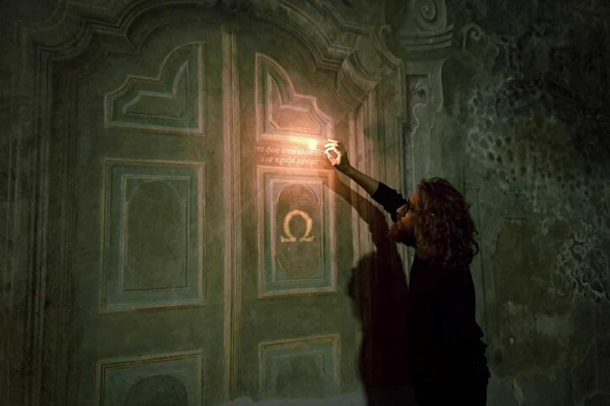 a woman standing in front of a door with a light