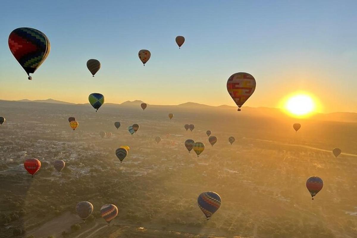 a bunch of hot air balloons flying in the sky
