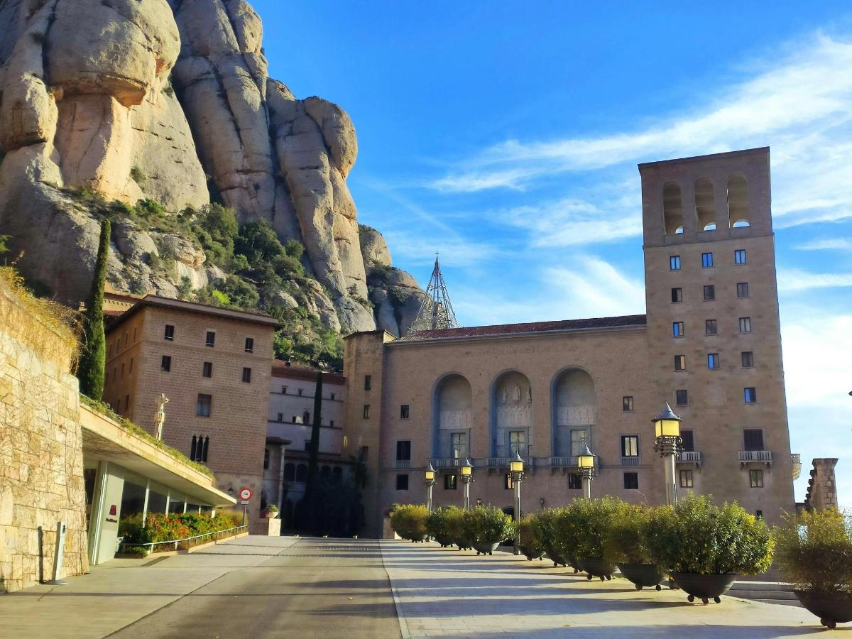 a building in front of a mountain with a church