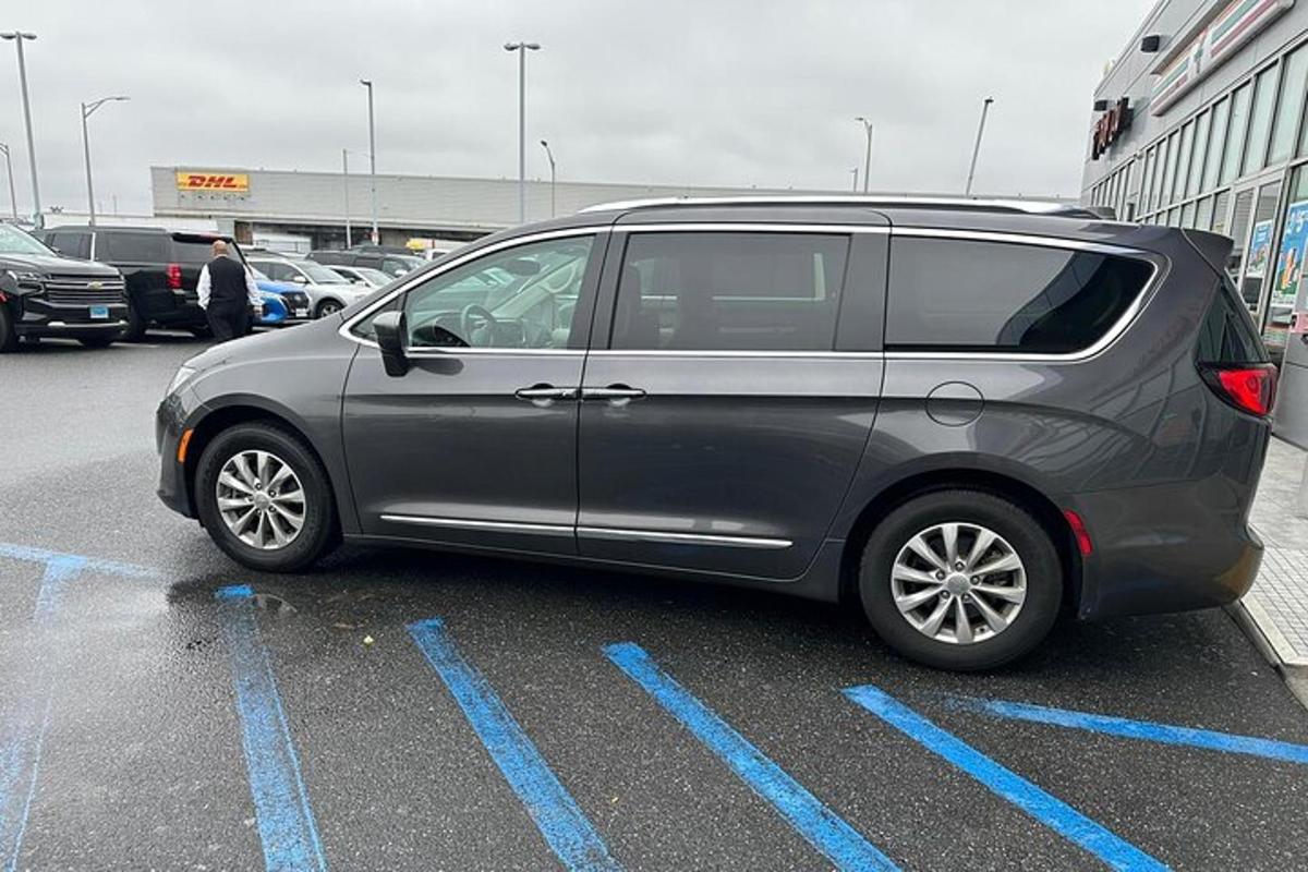 a silver van parked in a parking lot
