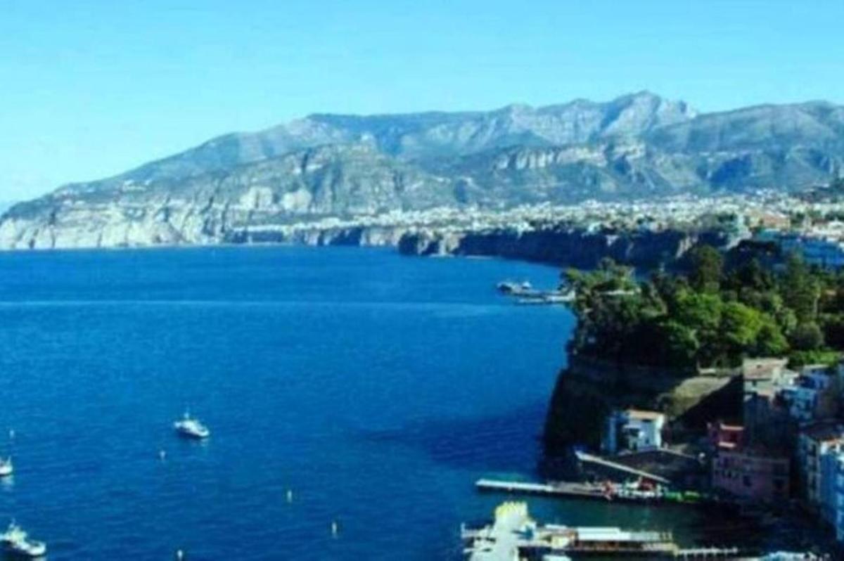 a view of a large body of water with mountains