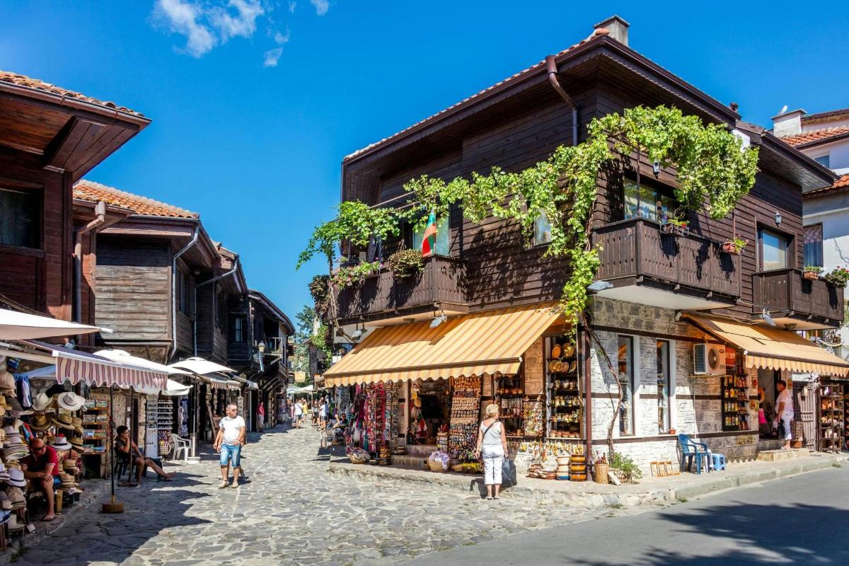 a street in a town with shops and buildings