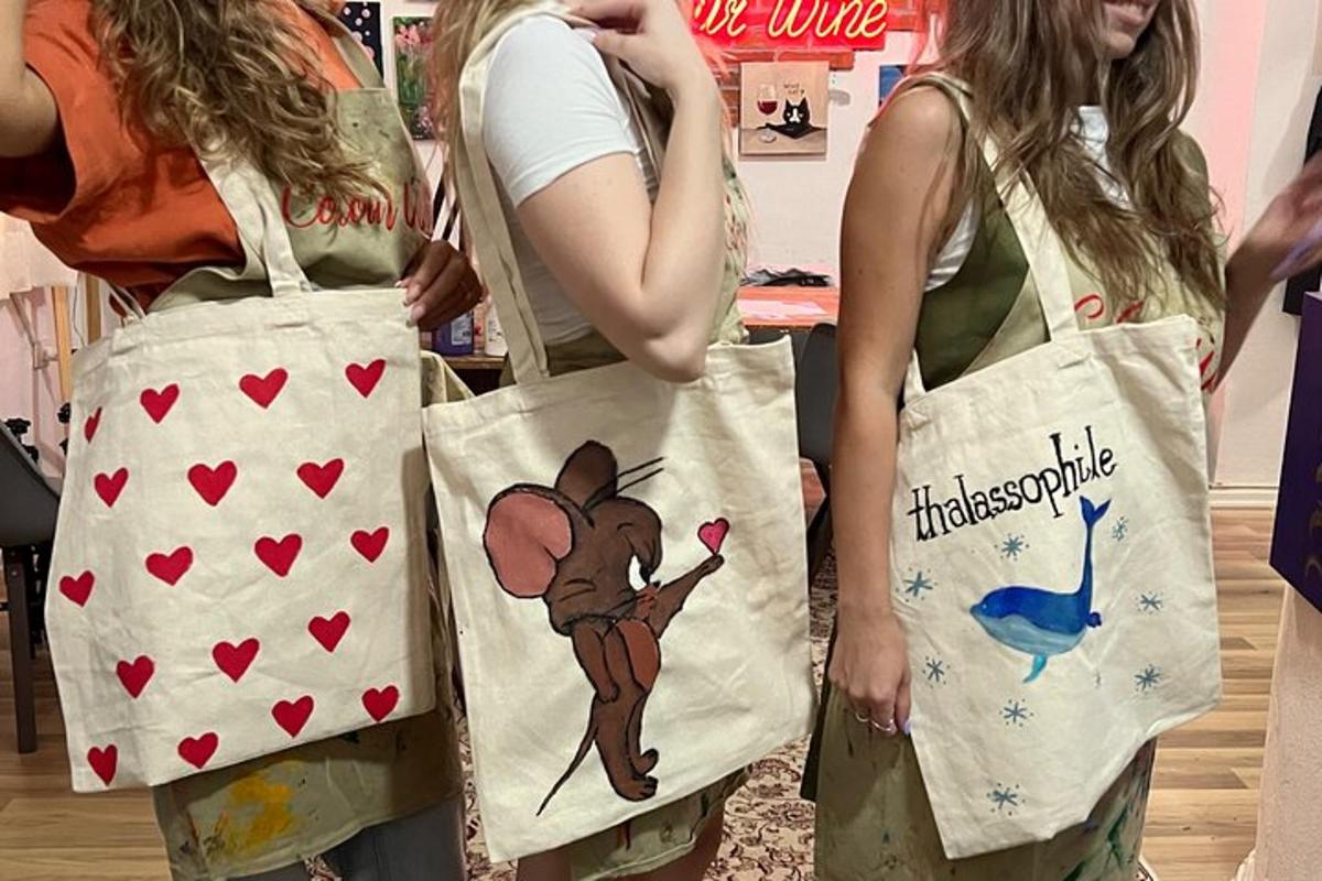 two women wearing aprons with mickey mouse on them