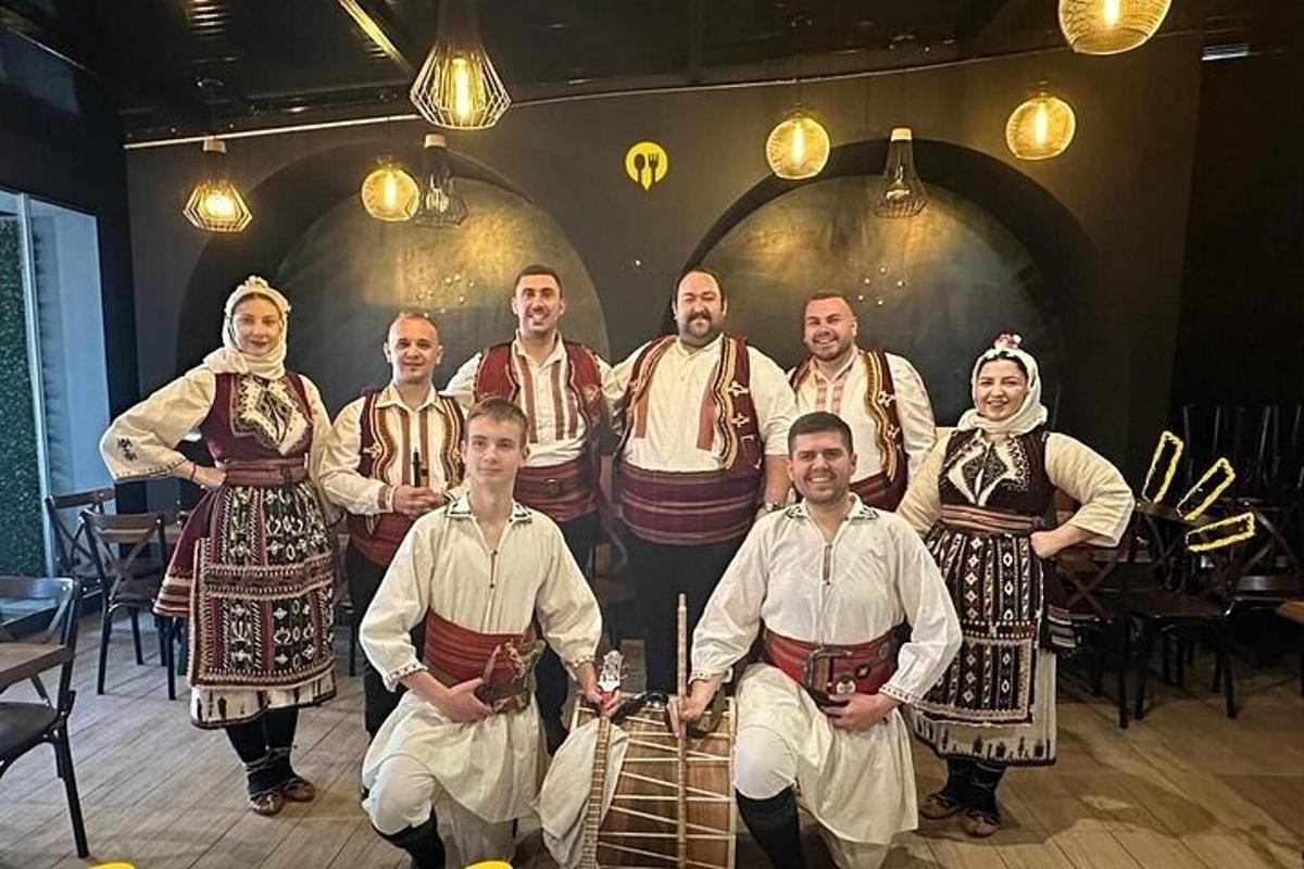 a group of people in traditional costumes posing for a picture