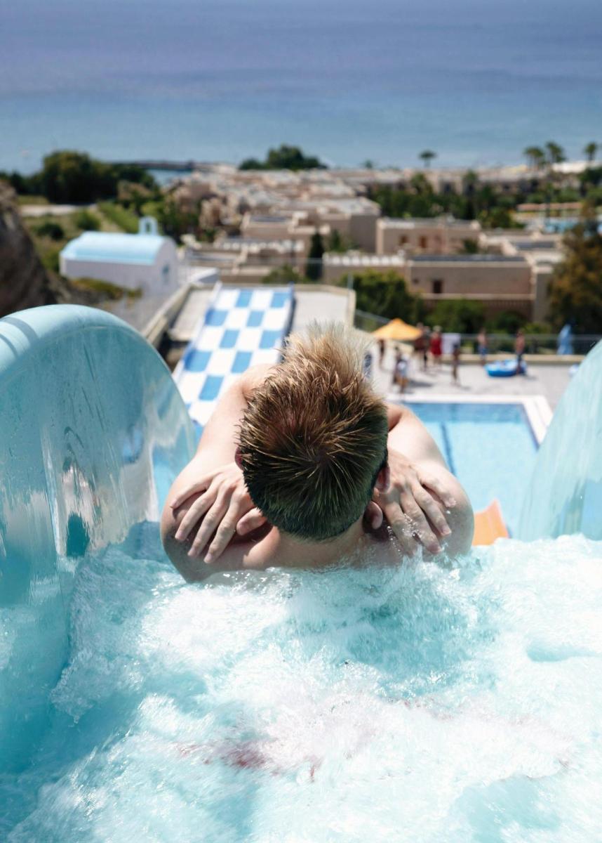a man in a pool with his head in the water