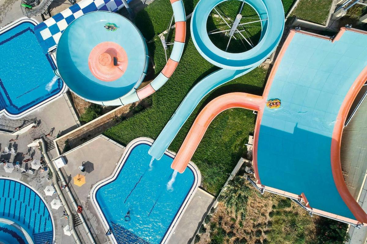 an overhead view of a swimming pool at a water park