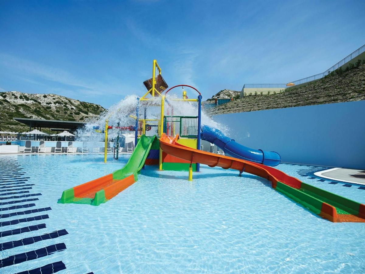 a water park with a colorful water slide