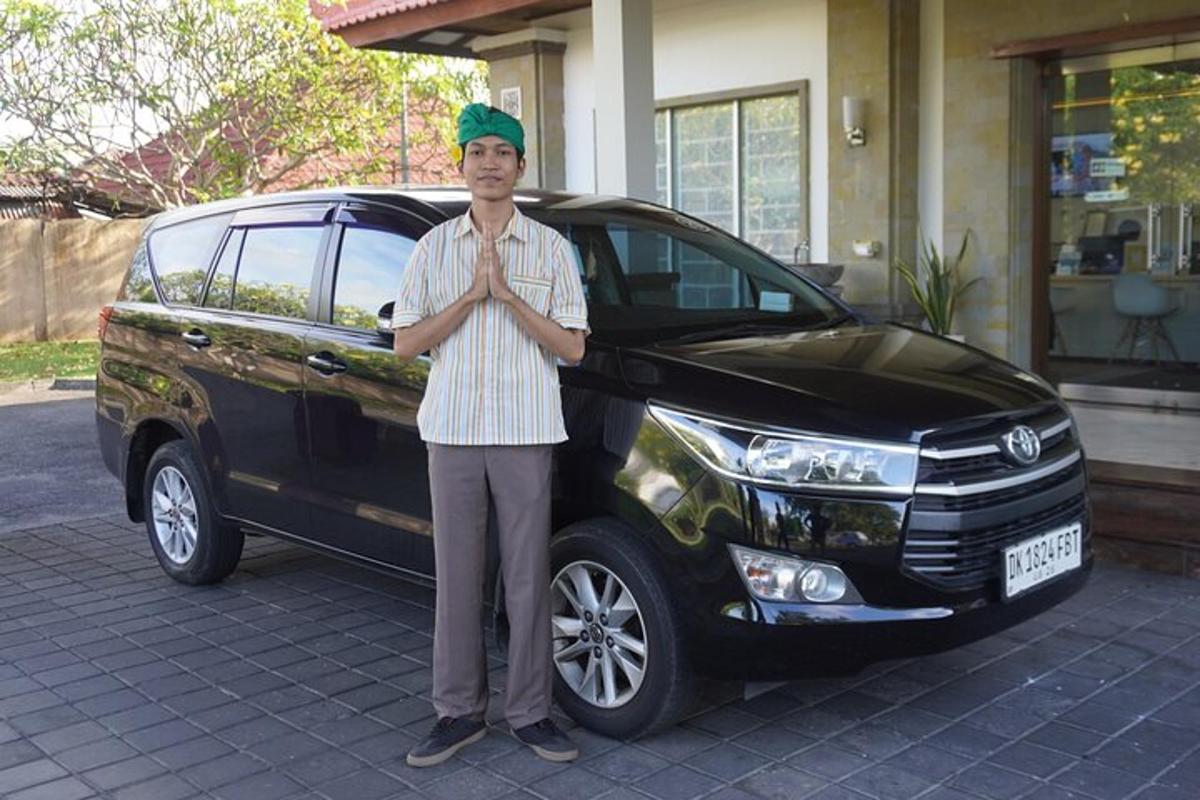 a man is standing in front of a car
