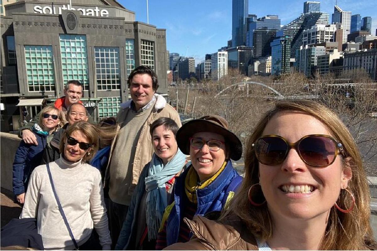 a group of people standing in front of a city