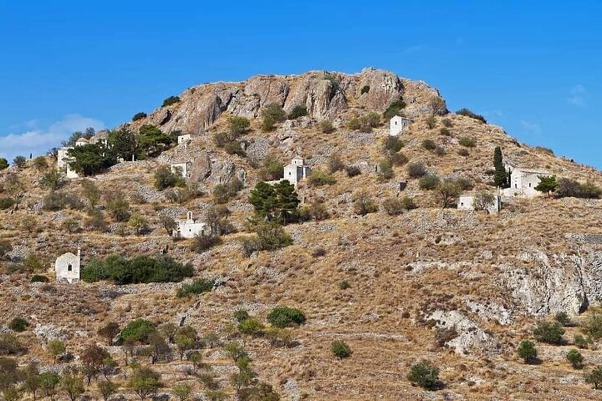 a hill with houses on top of a mountain