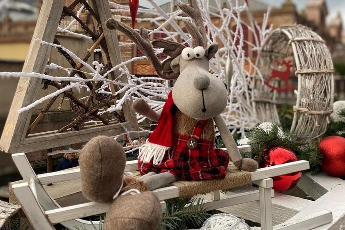 a stuffed reindeer sitting in a rocking chair