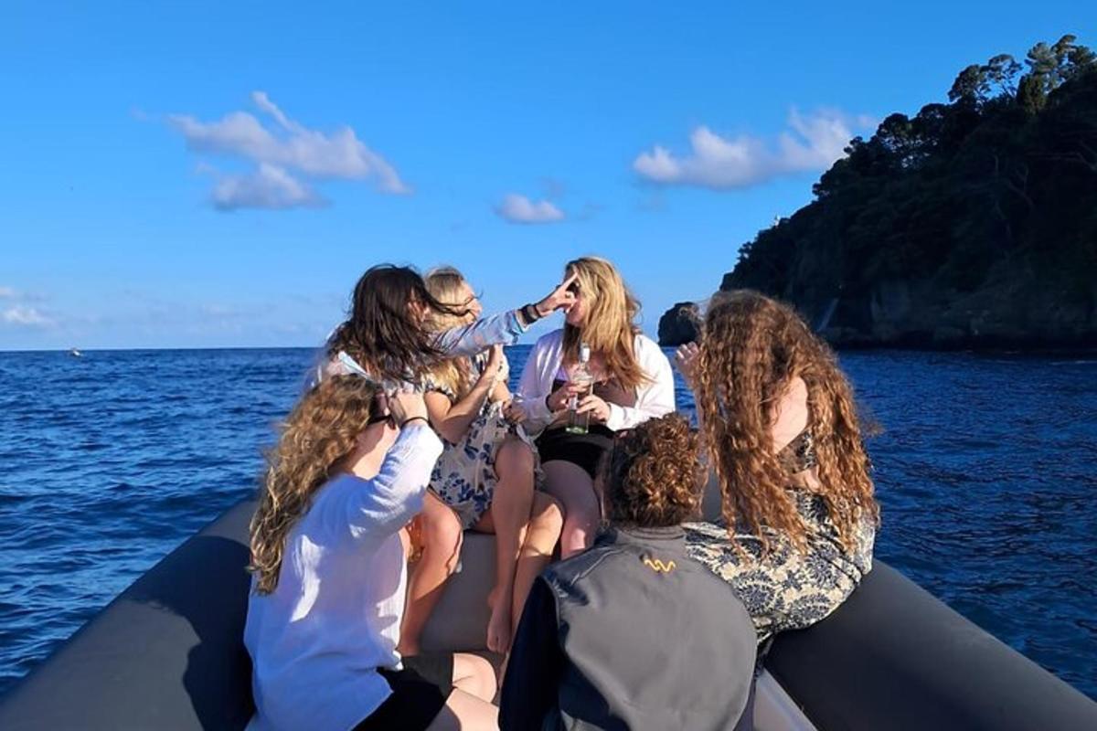 a group of people sitting on a boat in the water