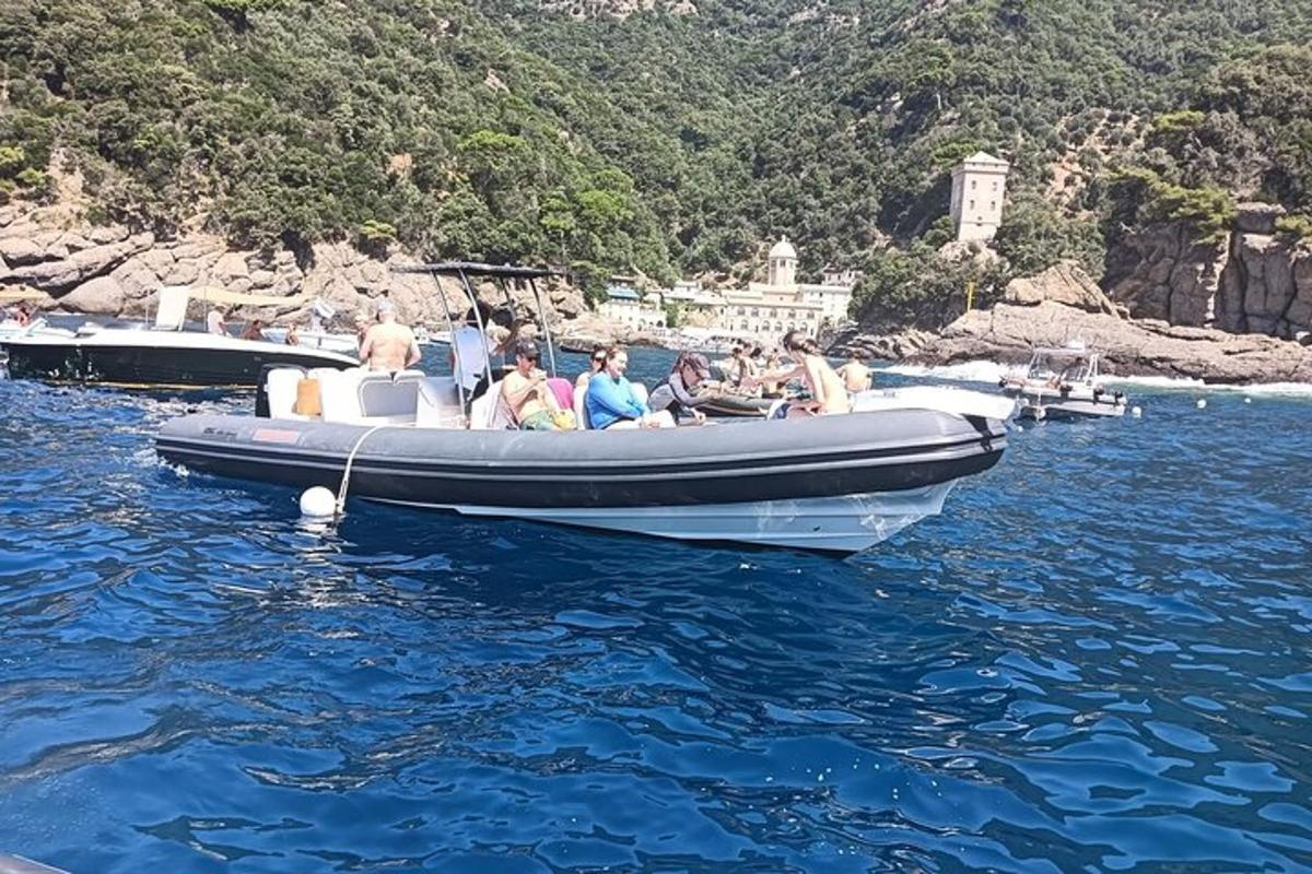 a group of people sitting on a boat in the water