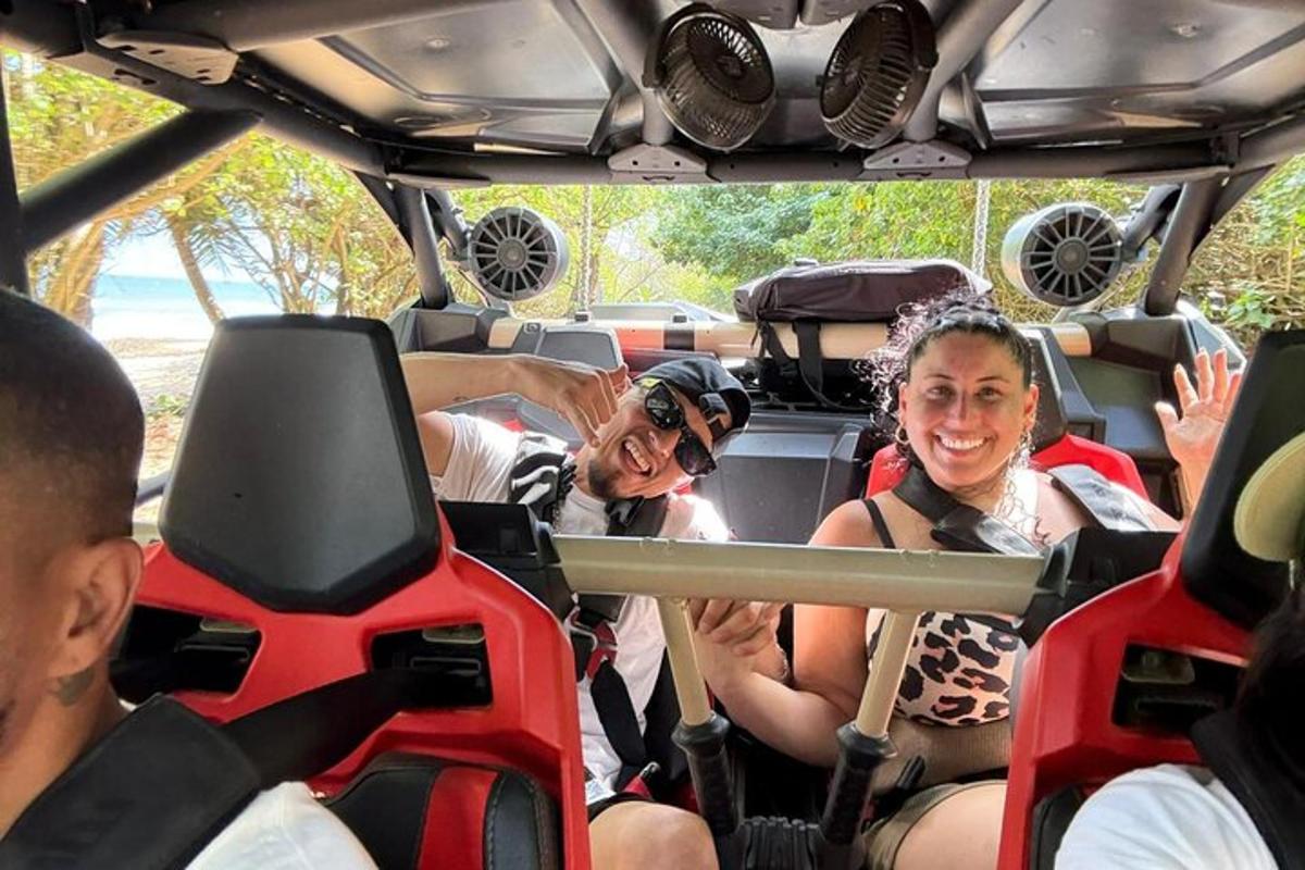 a group of people sitting in the back of a bus