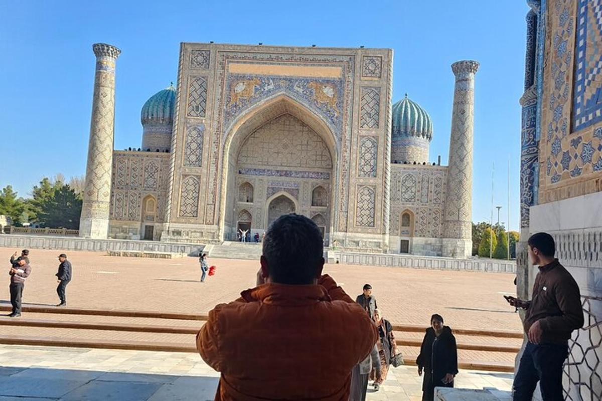 a person standing in front of a large building