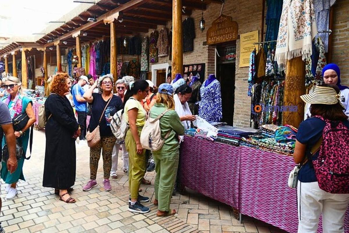 a group of people standing in front of a market