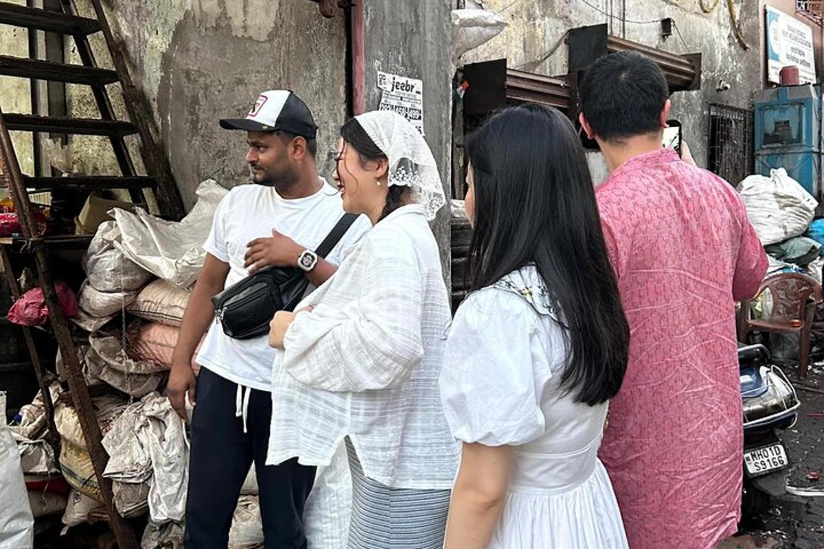 a group of people standing around in a market