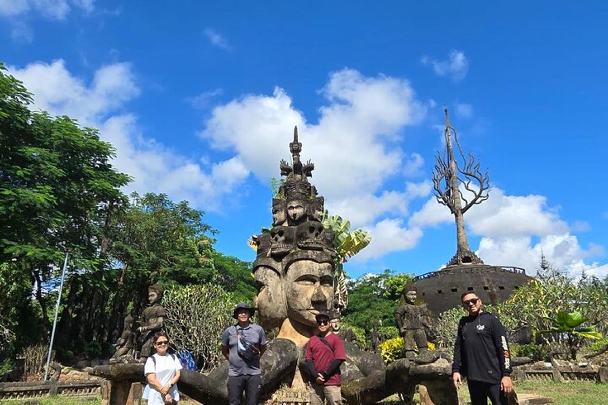 a group of people standing in front of a statue