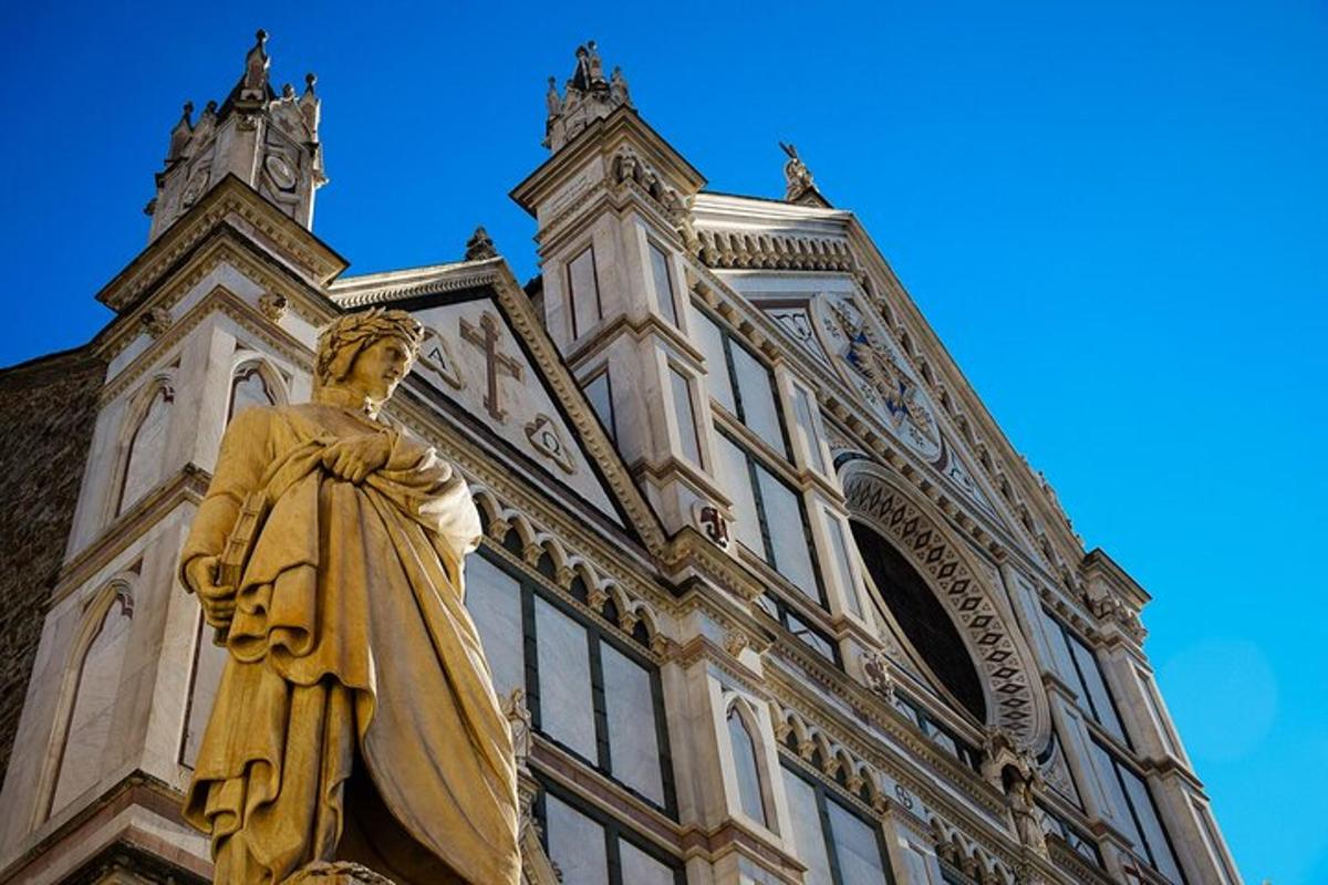 a statue of a man standing in front of a building