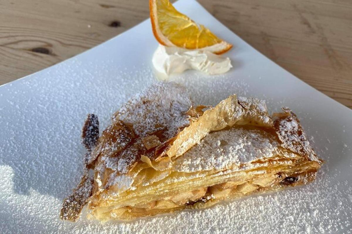 a piece of food on a plate with an orange slice