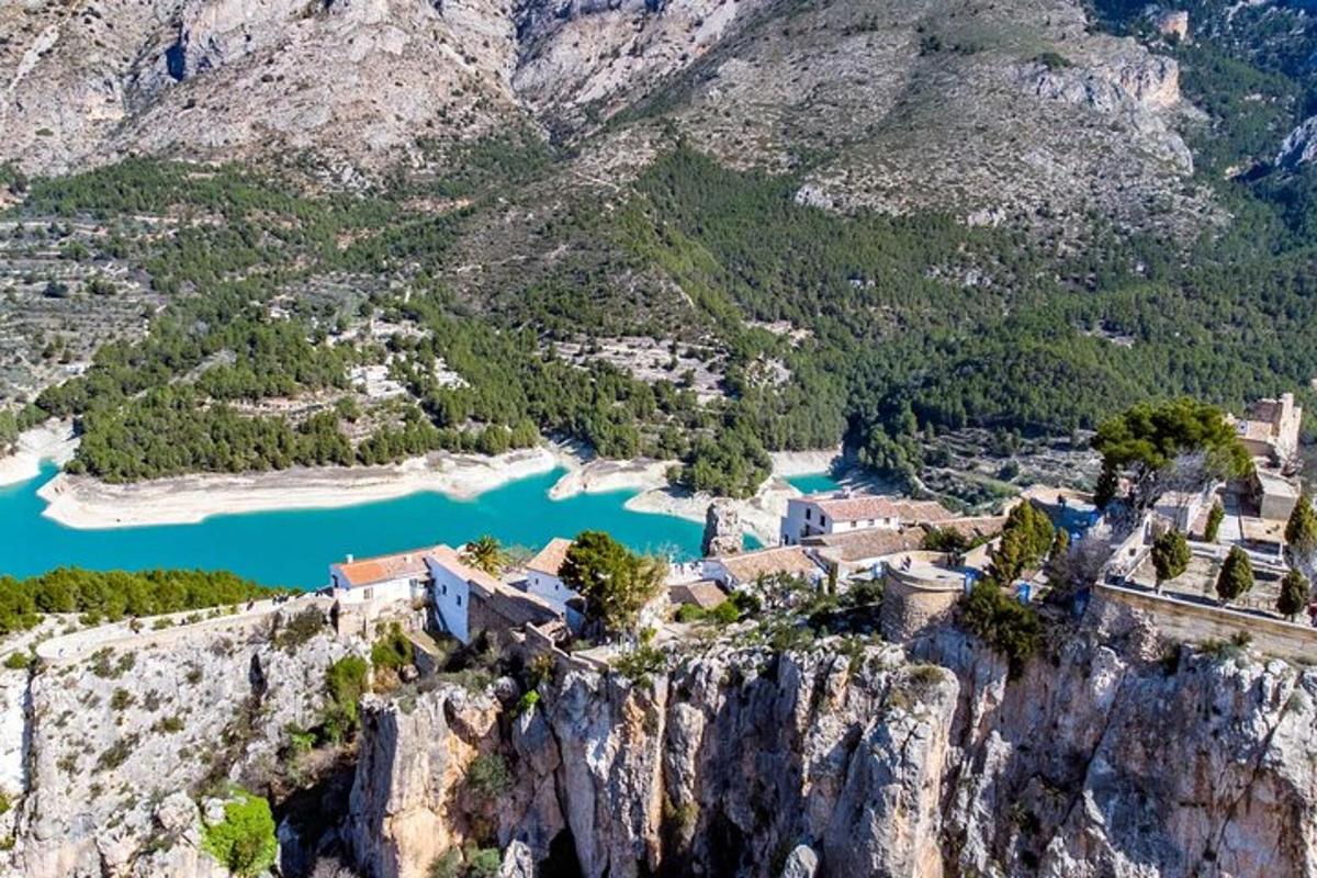 an aerial view of a village on the side of a mountain