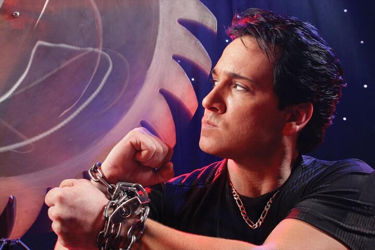 a man wearing a chain around hisarms