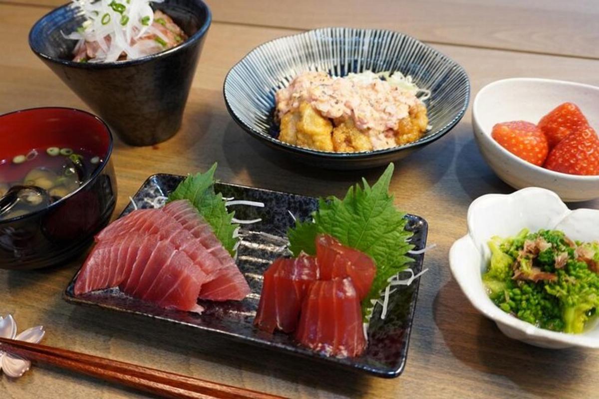 a table topped with plates of food and bowls of food