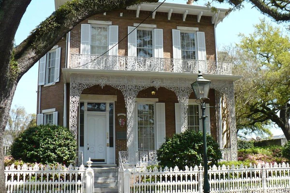 a house with a white fence in front of it